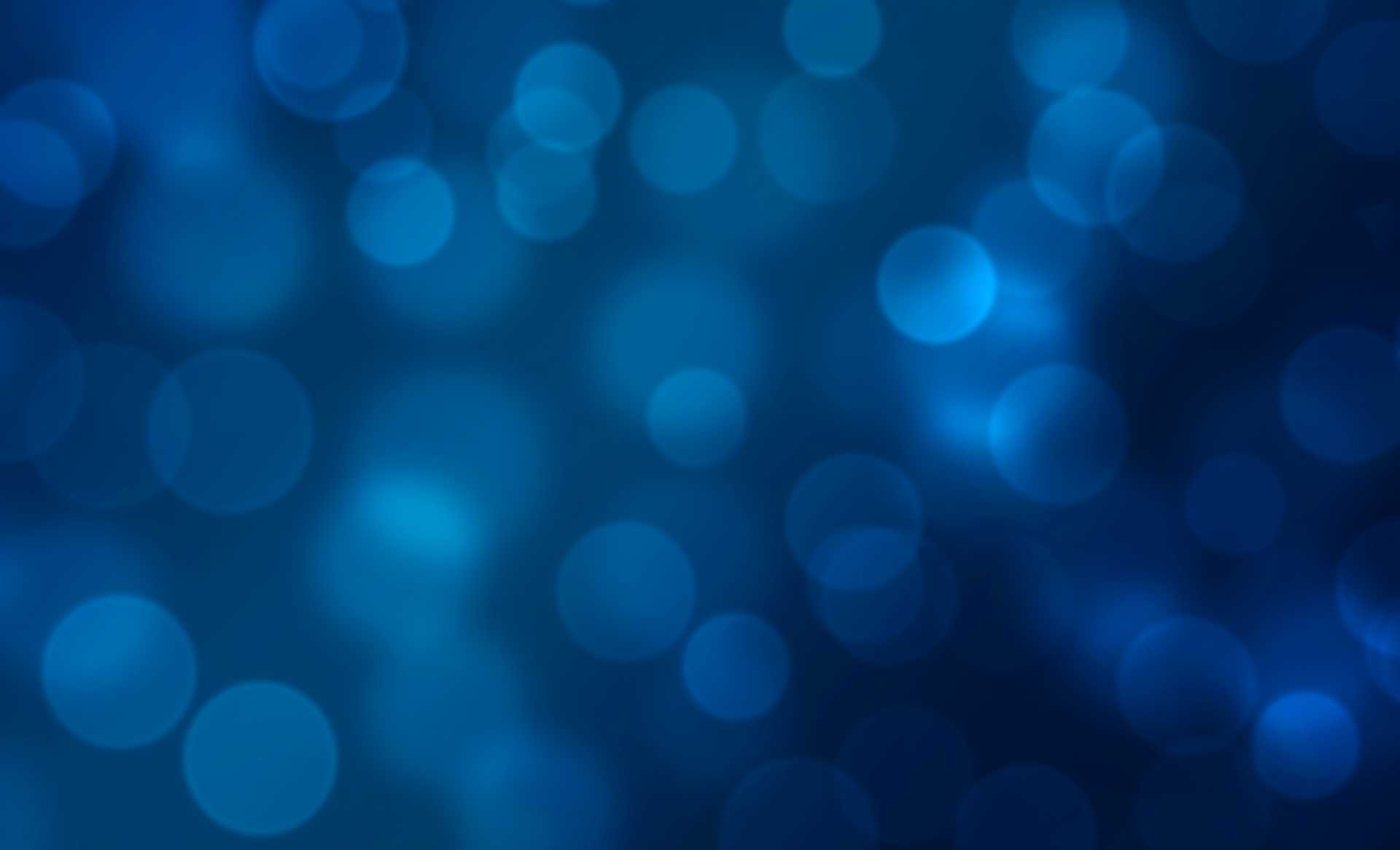 Blue background with blurred sparkling lights