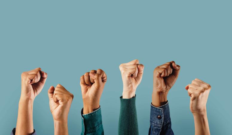 Group of People Raised Up Hands - stock image