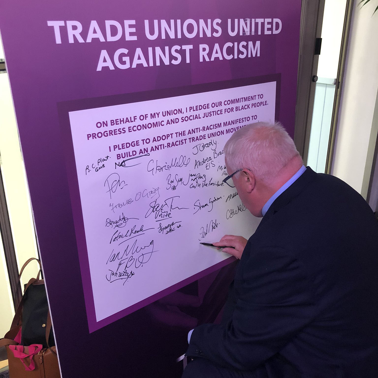 Ged signing the TU anti-racism manifesto
